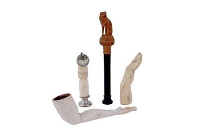 Lot 323 - Three various pipe tampers; and a clay pipe