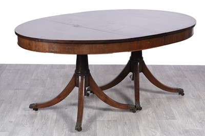 Lot 75 - A 19th Century inlaid mahogany oval extending pedestal dining table