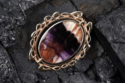 Lot A Blue John / Derbyshire spar, and blue lace agate reversible brooch