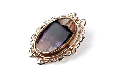 Lot 7 - A Blue John / Derbyshire spar, and blue lace agate reversible brooch