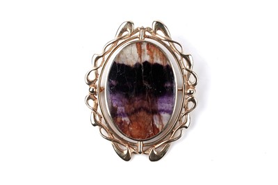 Lot 7 - A Blue John / Derbyshire spar, and blue lace agate reversible brooch