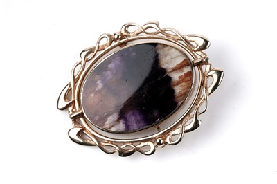Lot 7 - A Blue John / Derbyshire spar, and blue lace agate reversible brooch
