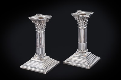 Lot 124 - A pair of Edwardian silver dressing table candlesticks