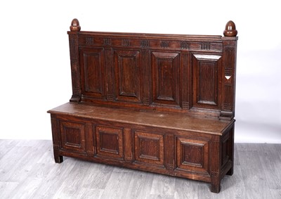 Lot 49 - A late 19th/early 20th Century oak settle or hall bench