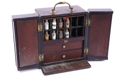 Lot A Georgian mahogany apothecary cabinet