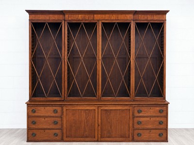 Lot 23 - An early 19th Century mahogany breakfront bookcase