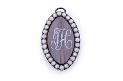 Lot 13 - A Georgian seed pearl mourning brooch