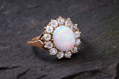 Lot 475A - An opal and diamond cluster ring