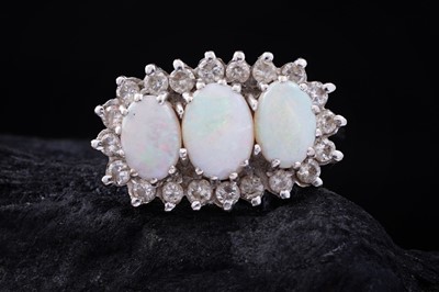 Lot 480A - An opal and diamond cluster ring