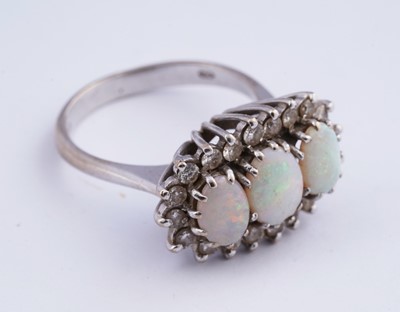 Lot 14 - An opal and diamond cluster ring
