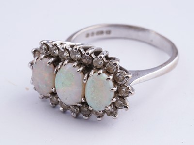 Lot 14 - An opal and diamond cluster ring