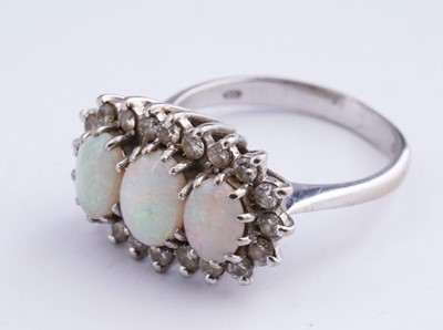 Lot 14 - An opal and diamond cluster ring