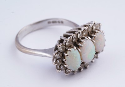 Lot 14 - An opal and diamond cluster ring