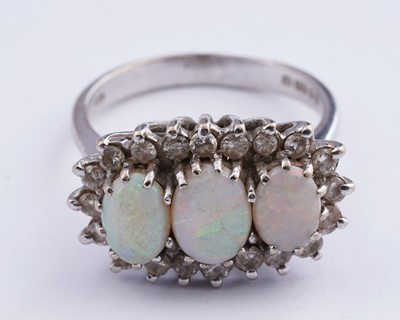 Lot 14 - An opal and diamond cluster ring