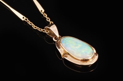 Lot 393 - An opal cabochon pendant