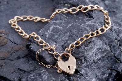 Lot 394 - A gold curb-link bracelet