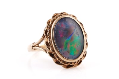 Lot 390 - A modern opal doublet ring