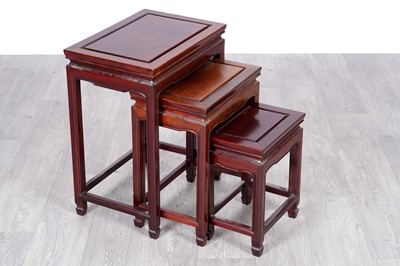 Lot 41 - A 20th Century Chinese hardwood nest of three tables