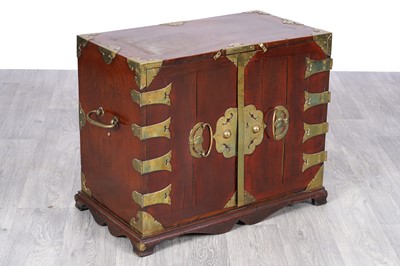 Lot 48 - A Korean elmwood and brass-bound cabinet