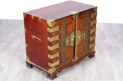 Lot 46 - A 20th Century Korean brass-mounted elm cabinet