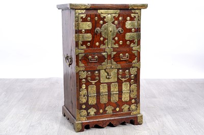 Lot 40 - A 20th Century Korean brass-bound elm cabinet