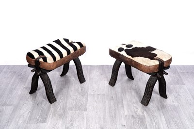 Lot 179 - A pair of 20th Century sub-Saharan folding stools