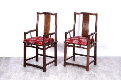 Lot 84 - A pair of 20th Century Chinese hardwood armchairs
