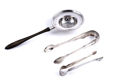 Lot 564 - An Edwardian silver tea strainer; and two pairs of sugar tongs