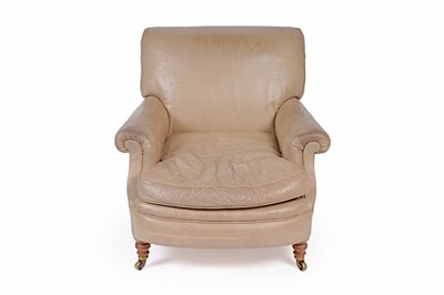 Lot 558 - Howard and Sons: a late Victorian beige leather upholstered armchair