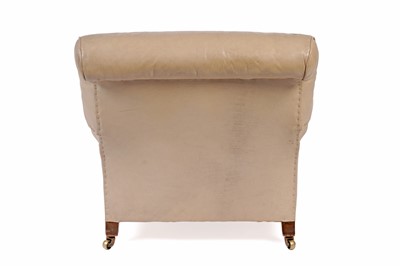 Lot 558 - Howard and Sons: a late Victorian beige leather upholstered armchair