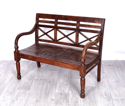 Lot 336 - A 20th Century Indonesian hardwood garden bench