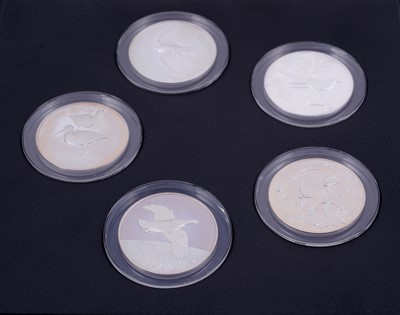 Lot 304 - Peter Scott's British Birds: A collection of thirty-five silver medals in a teak presentation box