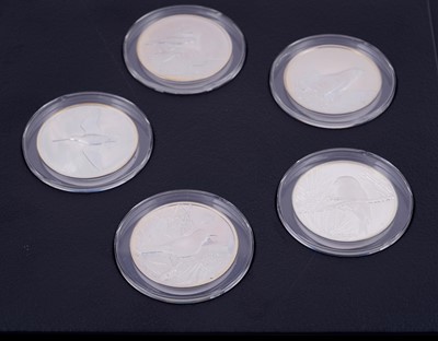 Lot 304 - Peter Scott's British Birds: A collection of thirty-five silver medals in a teak presentation box