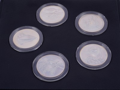 Lot 304 - Peter Scott's British Birds: A collection of thirty-five silver medals in a teak presentation box