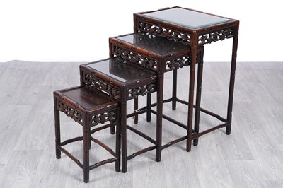 Lot 42 - A 20th Century Chinese hardwood nest of four tables