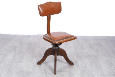 Lot 78 - An early 20th Century oak and faux-leather draughtsman’s chair