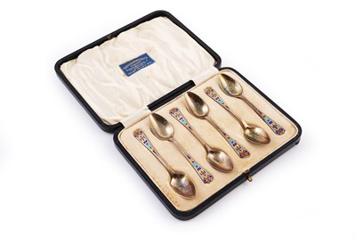 Lot 543 - A cased set of six George V silver teaspoons with champleve enamelled decoration