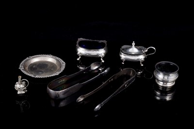 Lot 516 - Silver items including two pairs of Georgian silver sugar tongs
