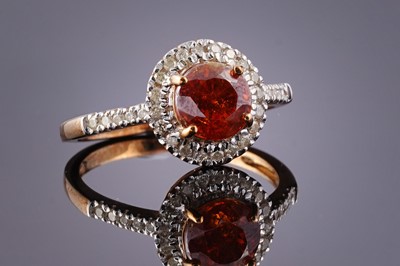 Lot 428 - A contemporary red sphalerite and diamond ring