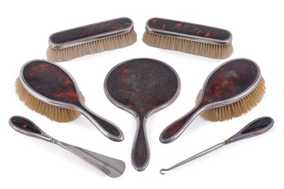 Lot 327 - A part silver mounted tortoiseshell dressing table set