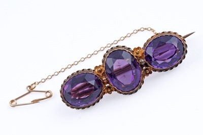 Lot 354 - A late 19th Century Etruscan Revival amethyst brooch