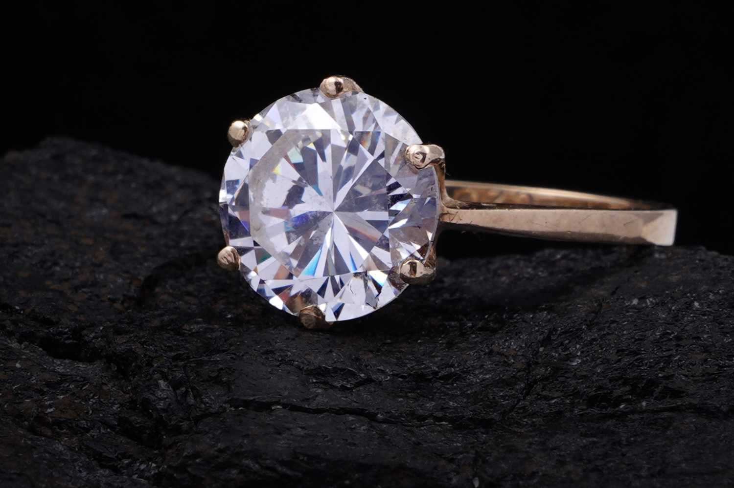 Lot 3 - A 9ct gold and CZ solitaire ring