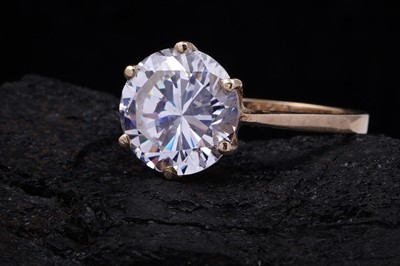 Lot 3 - A 9ct gold and CZ solitaire ring