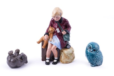 Lot 244 - A Royal Doulton figure; and two others