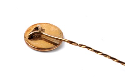 Lot 76 - A Chinese jade cabochon ring, and a tie pin