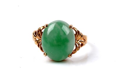 Lot 76 - A Chinese jade cabochon ring, and a tie pin