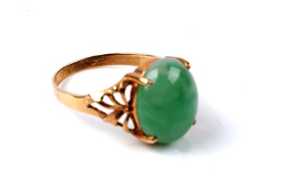 Lot 76 - A Chinese jade cabochon ring, and a tie pin