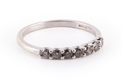 Lot 453 - A contemporary diamond half-hoop eternity ring