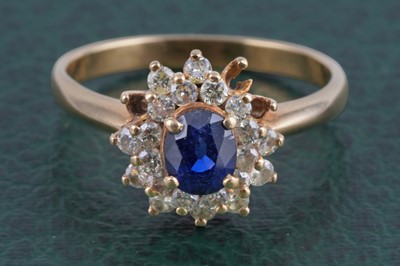 Lot 367 - A modern sapphire and diamond ring
