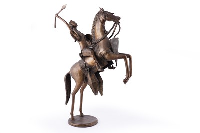 Lot 595 - A North African brass warrior on horseback